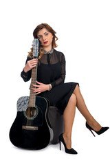 Obraz premium Portrait of a young business woman with guita isolated on white background