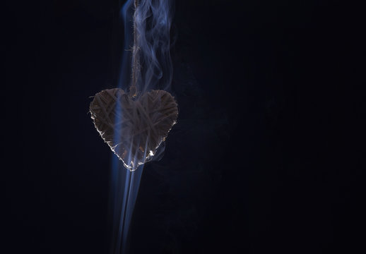 decorative valentines day heart in smoke on black background