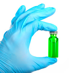 vial with a vaccine or cure for holding a blue gloves