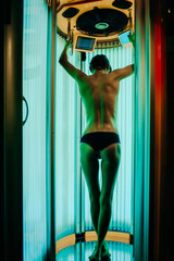 pretty woman with sexy body in solarium