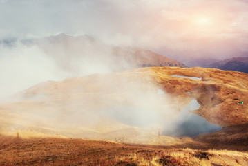 Sunset on mountain lake Koruldi. Upper Svaneti, Georgia, Europe