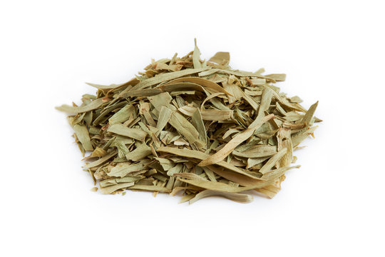 Pile of dried tarragon leaves isolated on white background