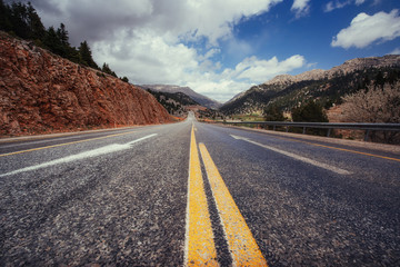 View of a asphalt road that video to the mountains