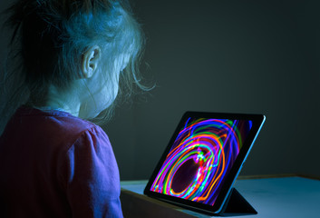 Litlle girl watching tablet PC