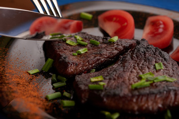 fried steak on a wooden table