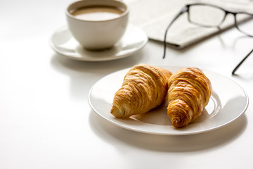 Business lunch with croissant on white table top view