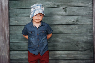 Happy little boy, child in a Panama hat.
