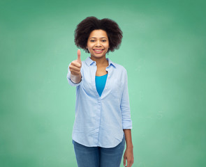 happy afro american woman showing thumbs up