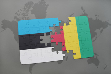 puzzle with the national flag of estonia and guinea on a world map