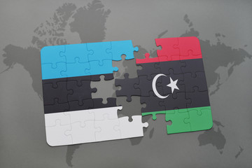 puzzle with the national flag of estonia and libya on a world map