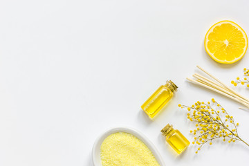 Yellow cosmetic set for body care on white background top view