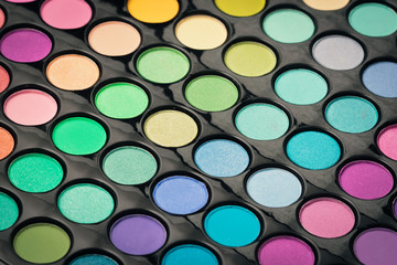 Macro shot of glossy make-up powder. Colorful makeup palette