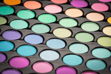 Macro shot of shiny make-up palette. Colorful makeup texture