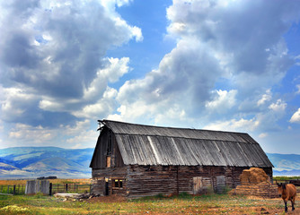 Log Barn and Landscape Scene