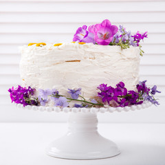 Cake Festive  with Cream decorated with fresh Flowers.selective focus.