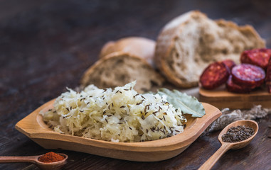 Farmer's Breakfast. Sausage, Sour Cabbage and Bread. Raw Ingredients.