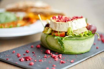 goat cheese salad with vegetables at restaurant
