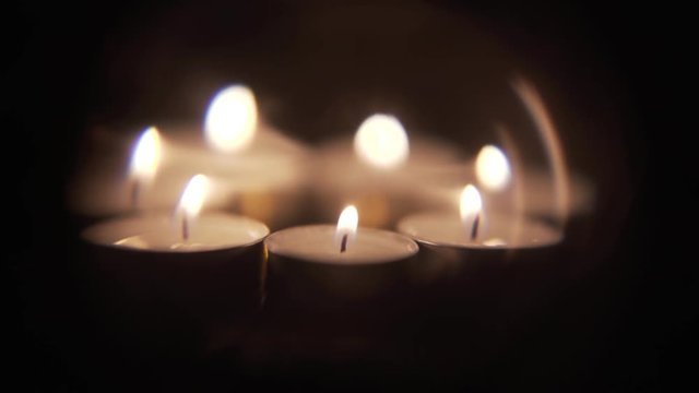 This shot of tea candles is part of a large collection of varying elements available in 4k or 1080p. If you&rsquo;re looking for a unique look or more options, please check out my channel for more.