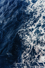 Fototapeta na wymiar Textural background. Blue waves of the sea 