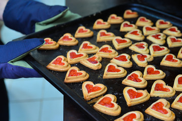 Pastry Filled with Jam on form of hearts on Baking Tray