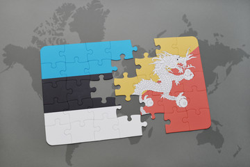 puzzle with the national flag of estonia and bhutan on a world map