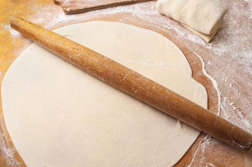 Preparation of the Dough on Wooden Background with Rolling Pin, Flour and Free Space for Text