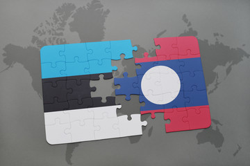 puzzle with the national flag of estonia and laos on a world map