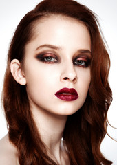 Beauty fashion model ginger hair and red makeup