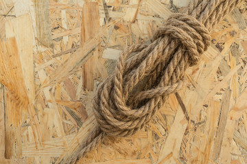 Fototapeta na wymiar rope made from flax loop, abstract background, closeup