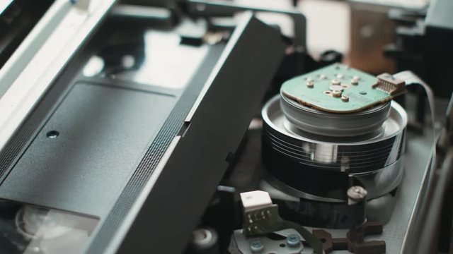 VHS Recorder Tape Sequence (4k). VHS recorder with tape showing inner workings with an insert and eject tape sequence with ambient audio included.