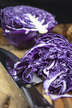 Purple Cabbage on a Cutting Board for Preparation of Sauerkraut Dish
