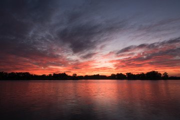 Fototapeta na wymiar Sunrise Over The Fishing Pond
