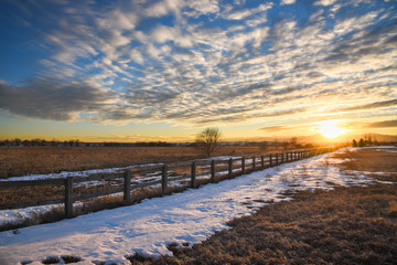 Snow Along the Fence at Sunset