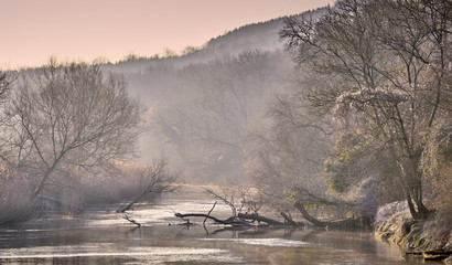 Frosty winter river landscape in the countryside