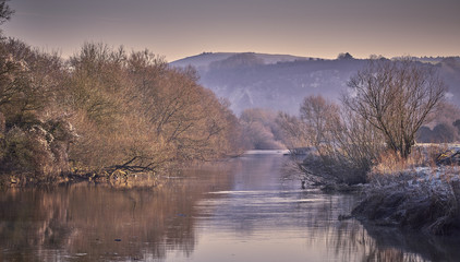 Frosty winter river landscape in the countryside