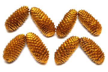 Golden fir cone isolated on white background. Flat lay, top view