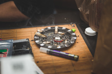 Joint ash tray on table