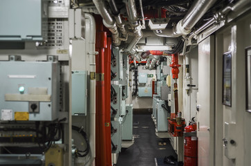 Ship's Engine Heavy Machinery Space - Pipes, Valves, Engines. selective focus, shallow depth of field