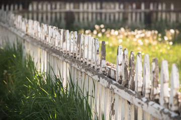  Rustic Fence With Broken Pickets and Unkempt Grass