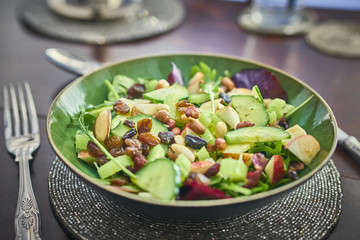 A healthy green salad in a bowl on the table