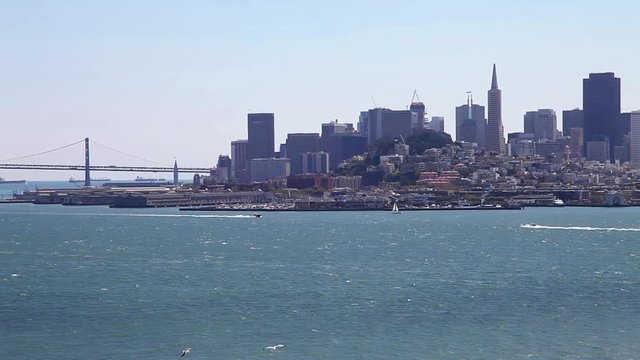 Aerial cityscape panorama of San Francisco Embarcadero and Oakland Bridge from Alcatraz prison overlook, California, United States. Travel and holidays concept. Urban San Francisco skyline. Sunny day.
