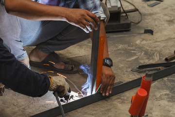 worker without welding protective gloves welding metal - Conditions Hazardous Working.