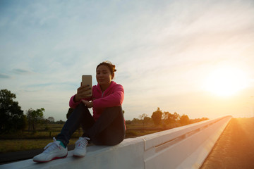 Women talk to friends via mobile phone.