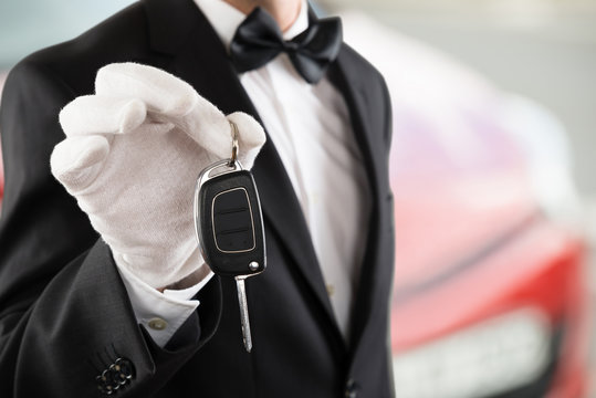 Valet Boy Holding A Car Key