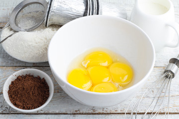 Ingredients for baking on a wooden background