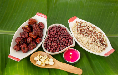 brown rice, redbeans, dried jujube, lotus seeds for good heath on banana green leave background