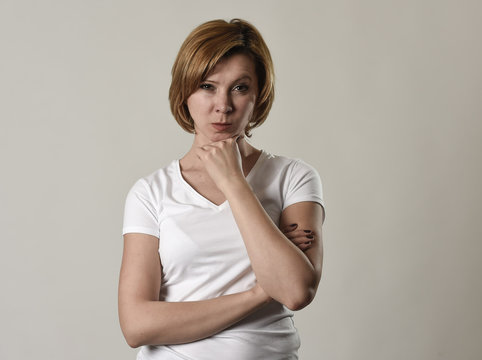young attractive and moody woman posing alone angry and upset in bad mood and rage face