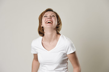 young beautiful red hair woman laughing happy and cheerful in friendly smile