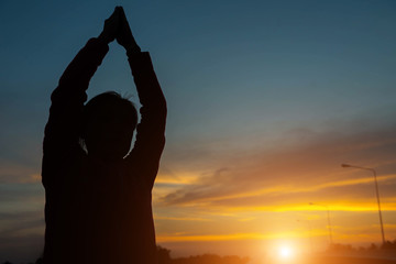 silhouette of woman Fitness to stand up in the sky.