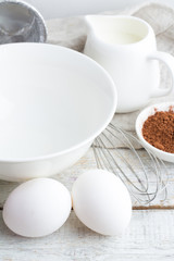 White utensils and ingredients for baking closeup